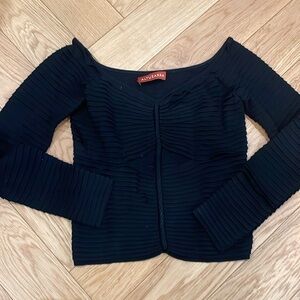 Black knit top with peekaboo hole below breast